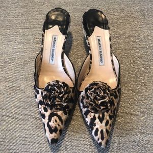 Manolo Blahnik leopard slides with rosette detail